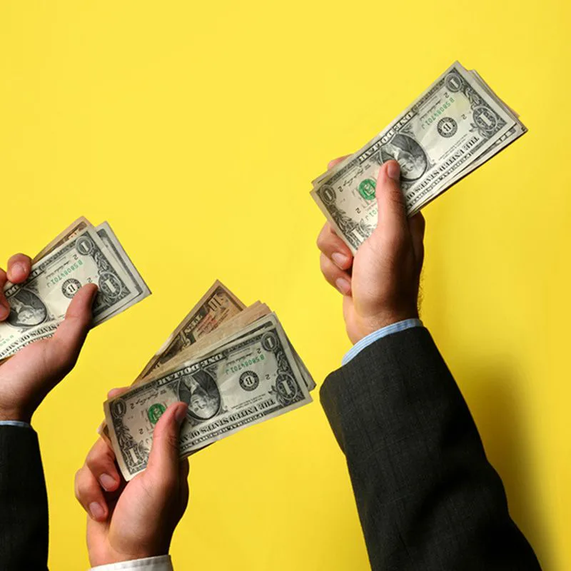hands with money