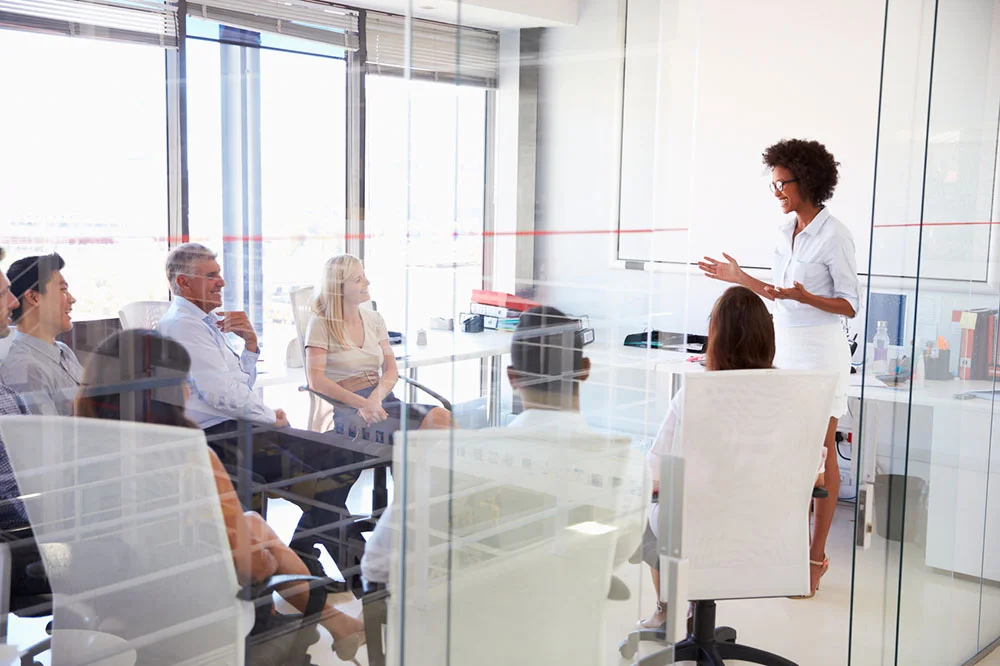 group meeting in glass conference room